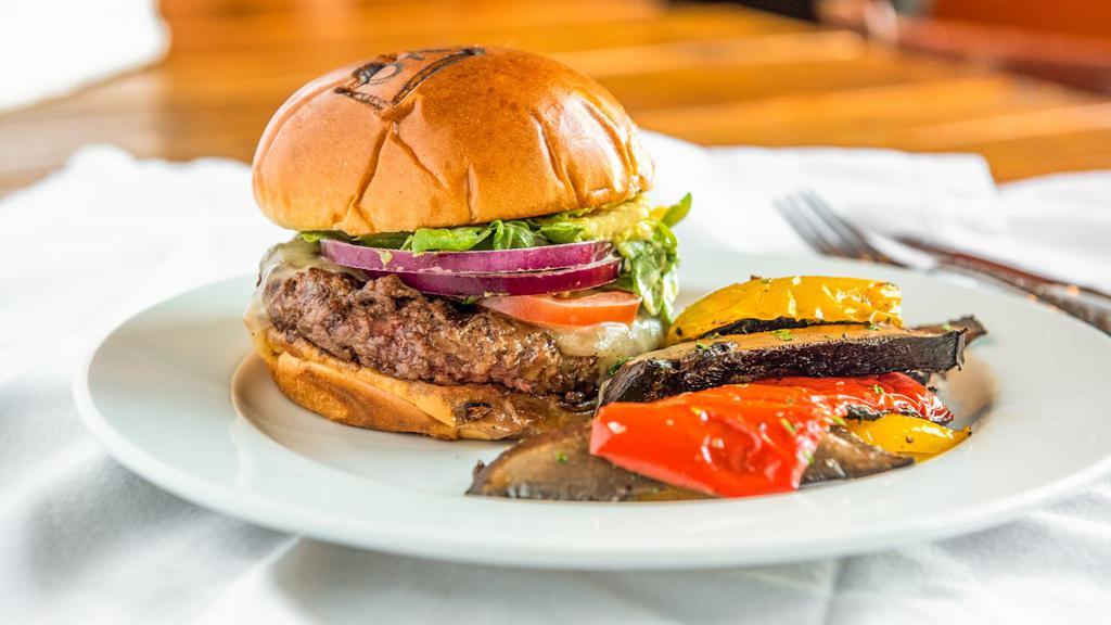 The Lokal · Burger topped with homemade honey mustard, melted jack cheese, avocado, tomatoes, sliced red onions, and arugula. Served with a side of your choice.