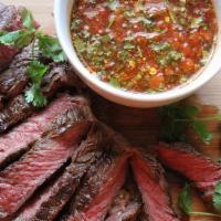 Tiger Crying · Grilled 14 oz New York Strip steak marinade in Thai herbs & served with Yisan spicy sauce.