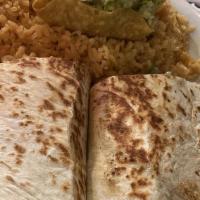 Spinach Quesadilla · Spinach quesadillas cooked with onions and tomatoes, served with rice and beans.