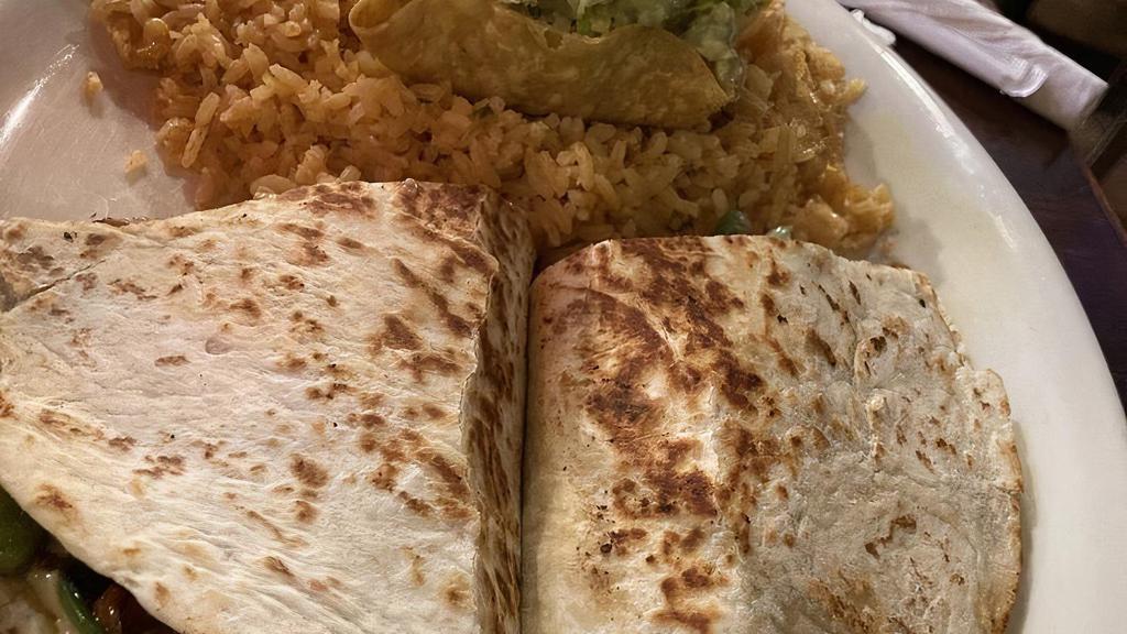 Spinach Quesadilla · Spinach quesadillas cooked with onions and tomatoes, served with rice and beans.