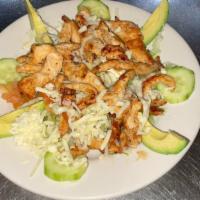 Chicken Salad · Grilled chicken on top of lettuce, tomatoes, onions, cucumber shredded cheese, avocado and s...
