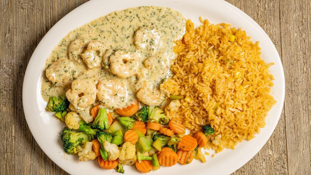 Camarón Al Mojo De Ajo · Shrimp prepared with our special butter-garlic sauce. Served with vegetables Mexican squash, rice and your choice of refried beans, charro beans or black beans.