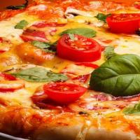 Margherita Pizza · Fresh thinly sliced tomatoes, basil, oregano, extra virgin olive oil, and Mozzarella cheese.