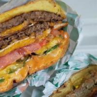The Yeti Deluxe Vegan Burger · Two vegan patties, two slices vegan cheese, ketchup, mustard, vegan mayo, tomato, grilled on...