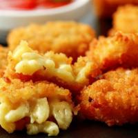 Mac & Cheese Bites · Oven baked macaroni and cheese made into bite size appetizers.