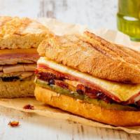 Cuban Sandwich A La Carte · Roasted pork, ham, swiss cheese, mustard, pickles on a 10