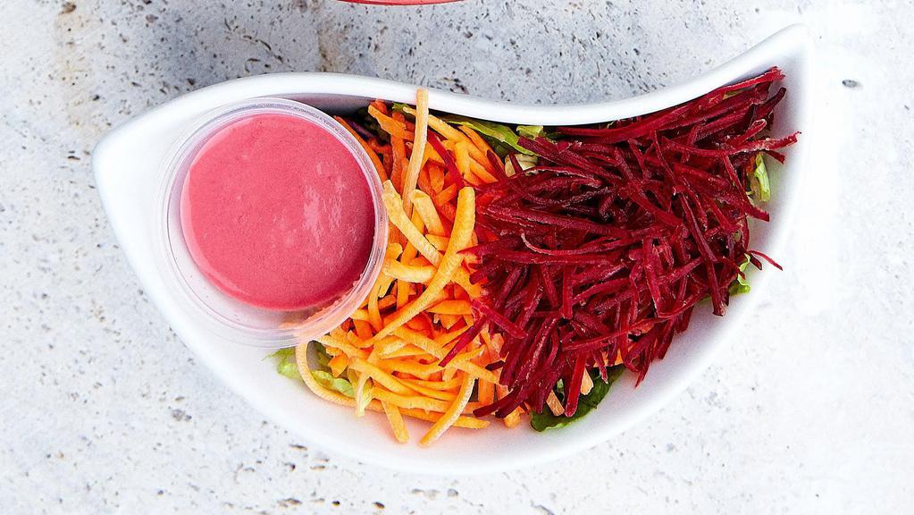 Ginger Miso Beet Salad · Lettuce, beet, and carrot with ginger miso beet dressing.