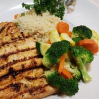 Grilled Chicken Breast Dinner · Served with rice pilaf and mixed vegetables.
