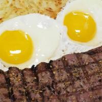 Steak & Eggs · 8 oz New York strip served with 2 eggs any style and hashbrowns.