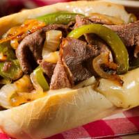 Philly Cheesesteak · Sliced steak, caramelized onions, Green peppers, Jack cheese Chef Mau's green Italian sauce.