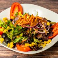 House Salad · Mix greens, tomatoes, corn, black olives, shredded carrots, balsamic dressing.