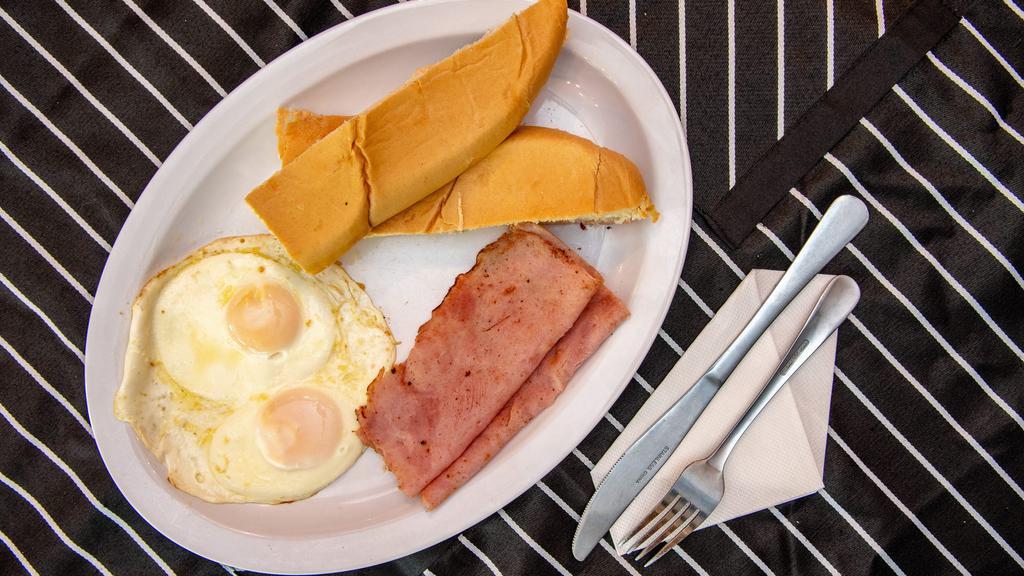 Manna Breakfast 2 · Two eggs scramble or fried  with ham with your choice of american toast or latin bread toast