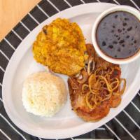 Manna Lunch 3 · Pork chop plater with a side  of rice and  beans and fried  plantains.