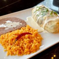 Fajita Burrito · Steak, chicken, and shrimp grilled with onions and bell peppers, rolled in a tortilla, toppe...