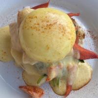 Lobster Benedict · Split and grilled gourmet English muffin topped with sautéed spinach, sliced tomato Maine lo...