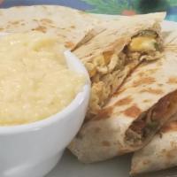 Eggsadilla · A spin-off classic quesadilla, large flour tortilla filled with eggs, peppers, onions, chedd...
