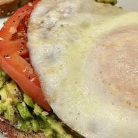 Avocado Toast · Two slices of whole-grain wheat topped with smashed avocado,sliced tomato, everything but th...