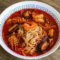 Spicy Seafood Ramen · Spicy creamy pork broth, shrimp, mussels, squids, noodles, sweet corn, black mushroom, bambo...