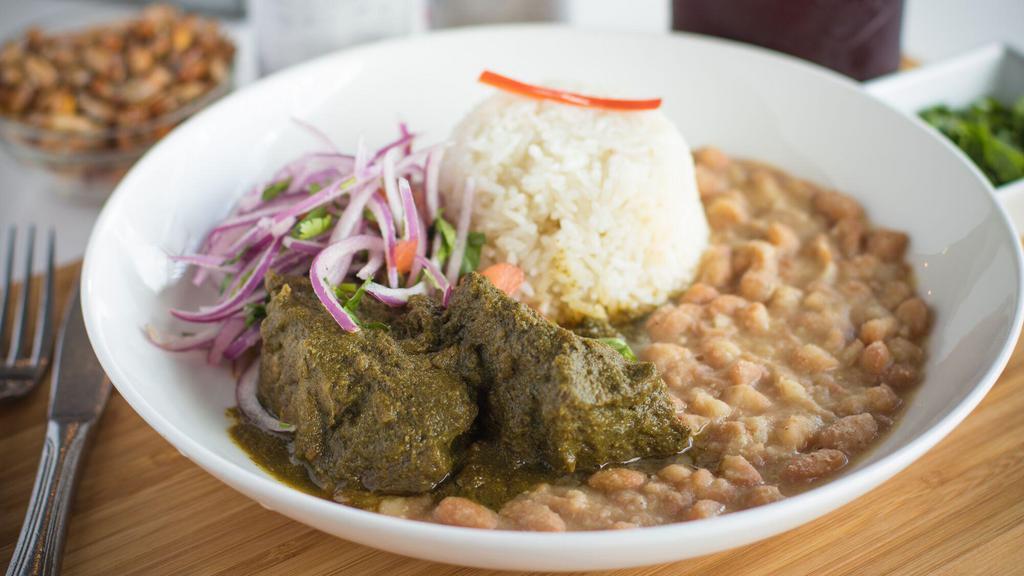 Seco De Res · Short rib stew, cilantro, canary beans, and white rice.