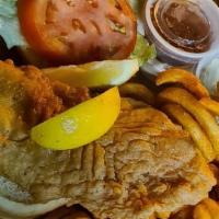 Grouper Sandwich · Choose blackened, grilled or fried.  All sandwiches topped w/lettuce, tomato & onion and ser...