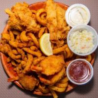Fried Combo · A tasty combo of fresh beer battered grouper, fried shrimp & clam strips.  Served w/curly fr...