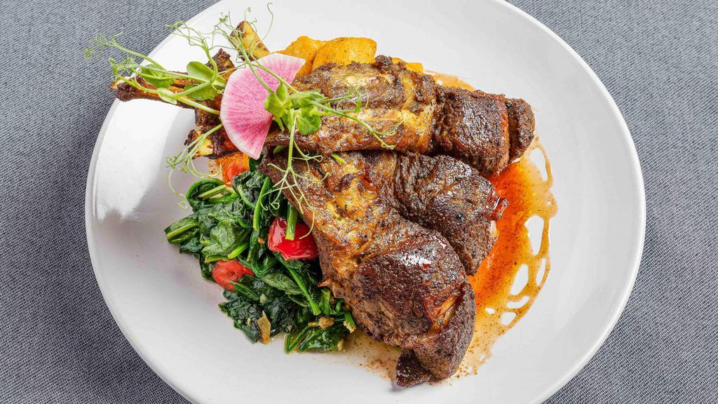 Spice Roasted Double-Cut Lamb Rib Chops · Spiced potatoes, garlic spinach, sumac gastrique, and mint oil.