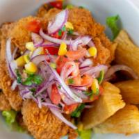 Chicharron De Pescado · Deep fried fish pieces with French fries or white rice.