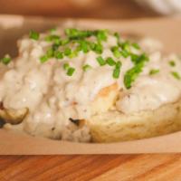 Biscuits & Gravy · Buttermilk biscuit topped with sausages gravy.