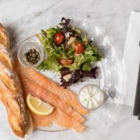 Smoked Salmon Breakfast · Smoked salmon with fresh baked bread, homemade ricotta chive spread, capers, lemon, and mixe...
