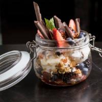 Granola Parfait · Item made with nuts. Greek yoghurt with homemade granola, honey, fresh fruit, coconut, orang...