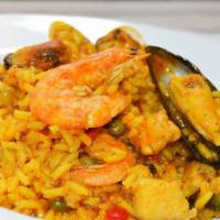 Arroz Con Mariscos · Our traditional secret  recipe seafood shrimp, calamari mussels and fish and Peruvian Pepper...
