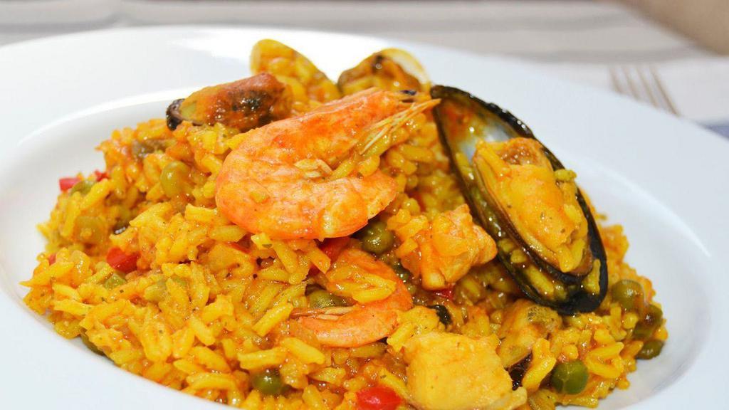 Arroz Con Mariscos · Our traditional secret  recipe seafood shrimp, calamari mussels and fish and Peruvian Pepper sauces .