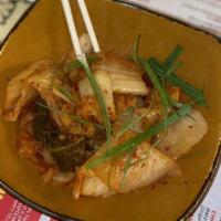 Kimchi · Spicy Korean style pickled cabbage, radish, chili, fish sauce.