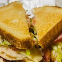 Turkey Club Sandwich · Smoked turkey,bacon, lettuce, tomatoes & mayo