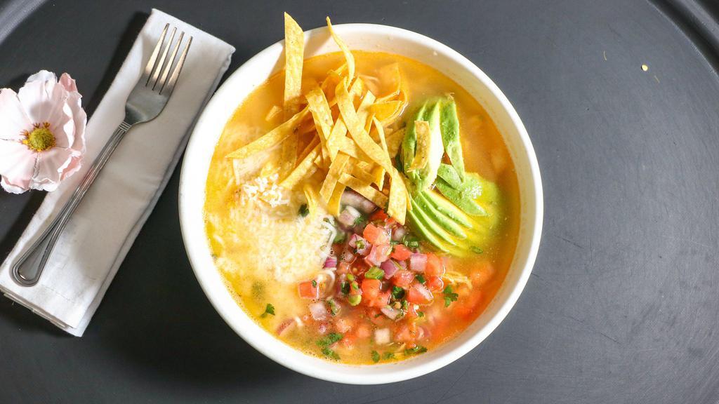 Tortilla Soup · Chicken broth with shredded chicken, rice, pico de gallo, and cheese. Topped with tortilla chips and sliced avocado.