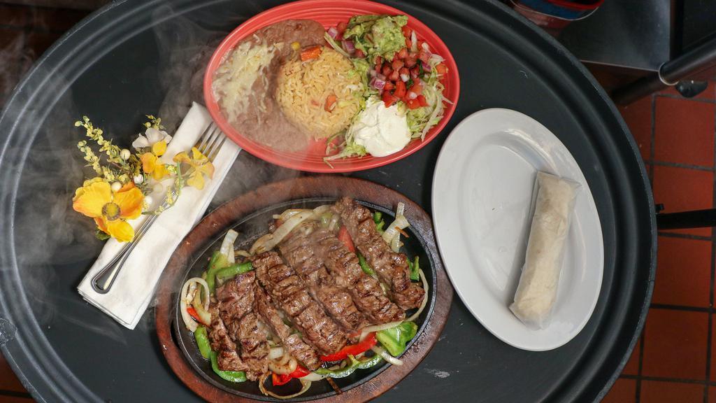 Grilled Fajitas · Your choice of meat cooked with onions and bell peppers.