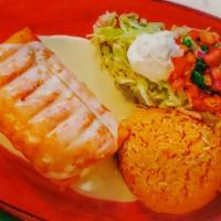 Chimichanga · A large flour tortilla stuffed with beans and your choice of beef or chicken, wrapped, and f...