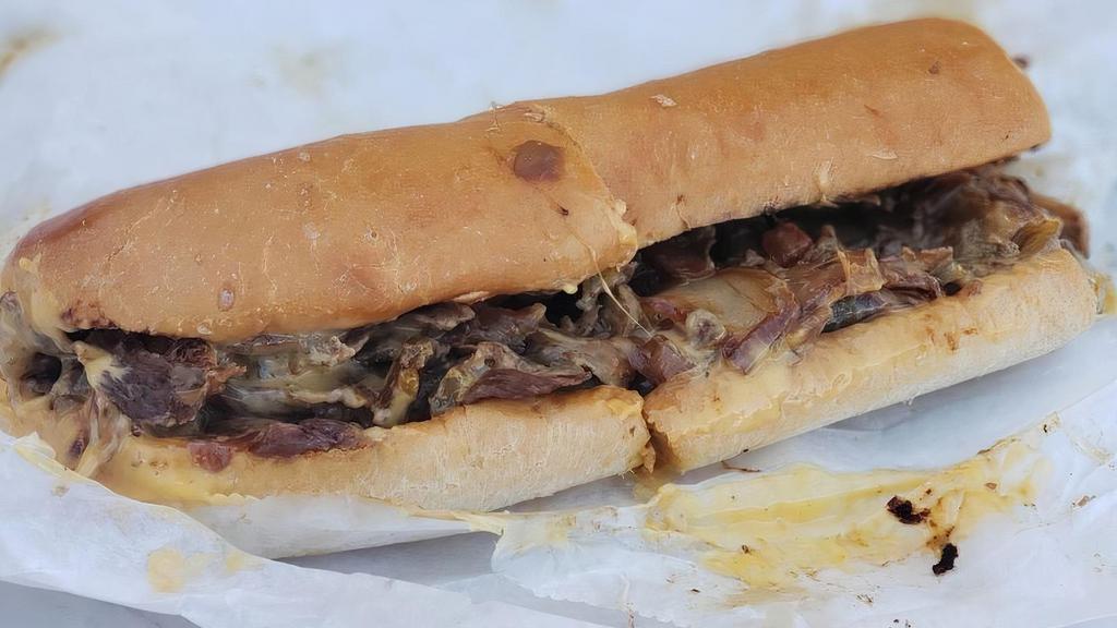 The Philly · Steak, choice of grilled onions and peppers, provolone or cheese whiz.