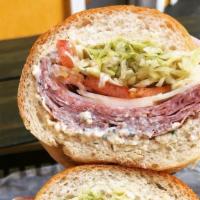 The Godfather · Not your ordinary Italian sub. Ham, capícola, salami, provolone, lettuce, tomato, red onion,...