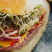 Roast Beast · Roast beef, cheddar cheese, tomato, red onion, sprouts, house horseradish mayo.
