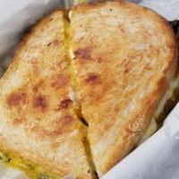 Grilled Montreal · Sourdough, pastrami, white cheddar curds, yellow mustard.
