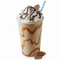 Snickers Ice Cream Milk Shake · Sweet cream ice cream, snickers, whipped cream, and chocolate syrup.