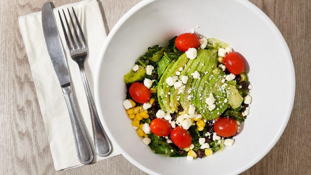 Avocado Chopped Salad · Fresh romaine and spring mix, with fresh avocado, tomatoes, corn, black beans, crumbled feta cheese, and your choice of one of our delicious dressings.
