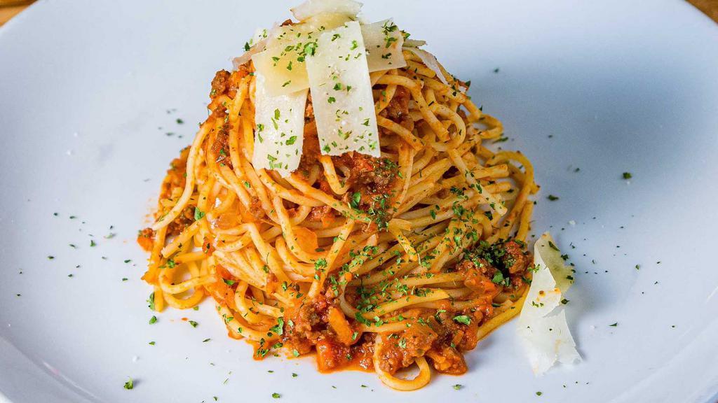 Bolognese Spaghetti · GROUND BEEF, TOMATO SAUCE, GARLIC, SAUTEED ONIONS, BASIL AND PARMESAN