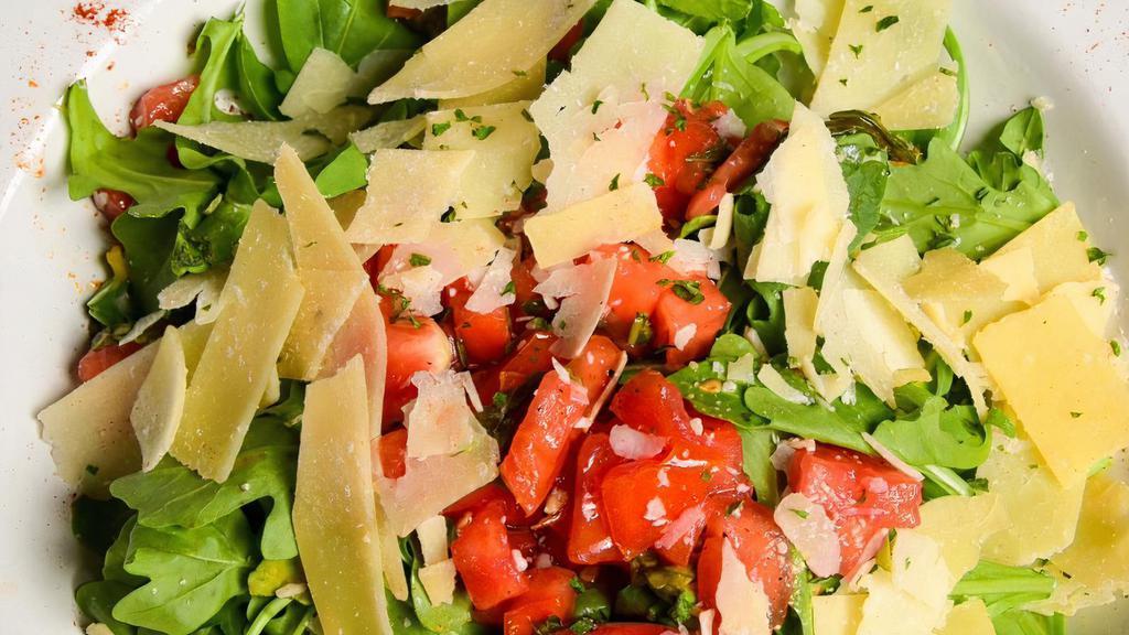 Napoli Salad · Arugula, chopped tomatoes, basil, garlic, shaved parmesan