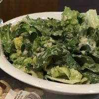 Side Caesar Salad · Romaine lettuce croutons and caesar dressing.