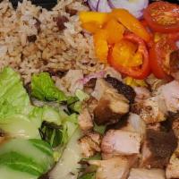 Jerk Chicken Bowl · Jerk Chicken, Rice and Peas, Fresh Salad, Red and Green Peppers, Tomatoes, Red Onions, Sweet...