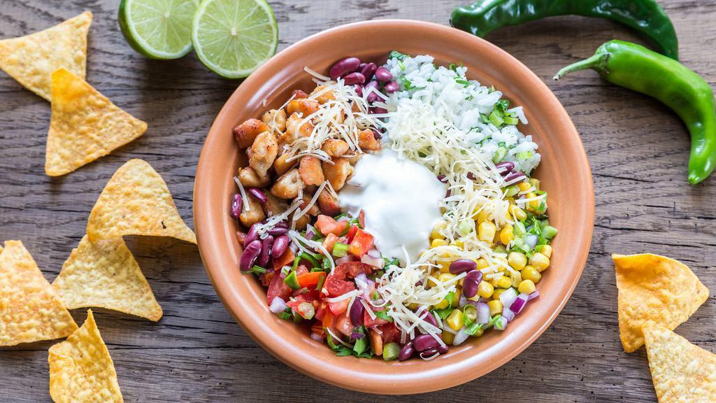 Burrito Bowl Cilantro · Heart mix of black beans, red and yellow peppers, red onions and corn on a bed of rice. Topped with creamy avocado slices.