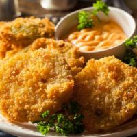 Fried Green Tomatoes · Three thick slices of breaded and golden fried, tangy green tomatoes.
