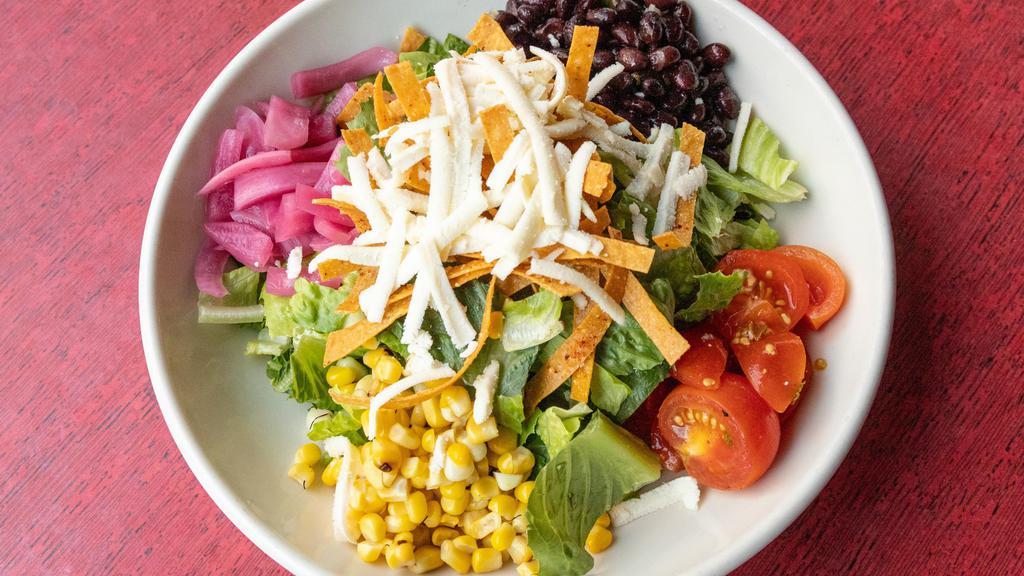Grande House Salad · El Taco house salad with choice of creamy cotija or tequila lime vinaigrette dressing.